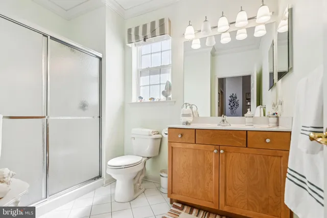 a spacious bathroom with a double vanity sink mirror and toilet