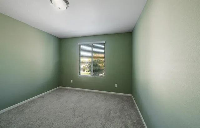 a bathroom with a sink a mirror and a shower