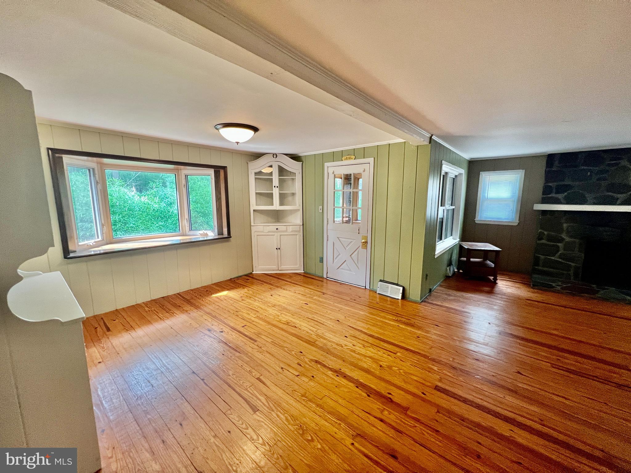 401 Bethel Mill Road, Unit A Pitman, NJ 08071 - Photo 6 of 18 a view of empty room with wooden floor and fan