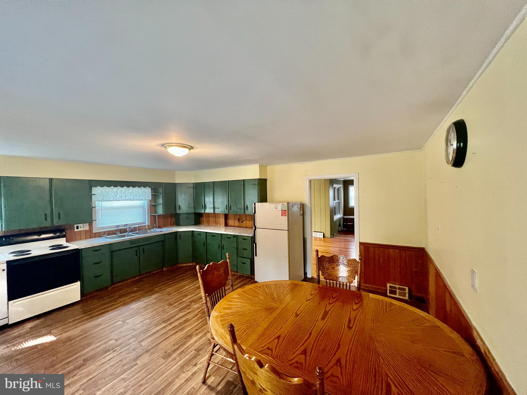 401 Bethel Mill Road, Unit A Pitman, NJ 08071 - Photo 9 of 18 a kitchen with a table and chairs in it