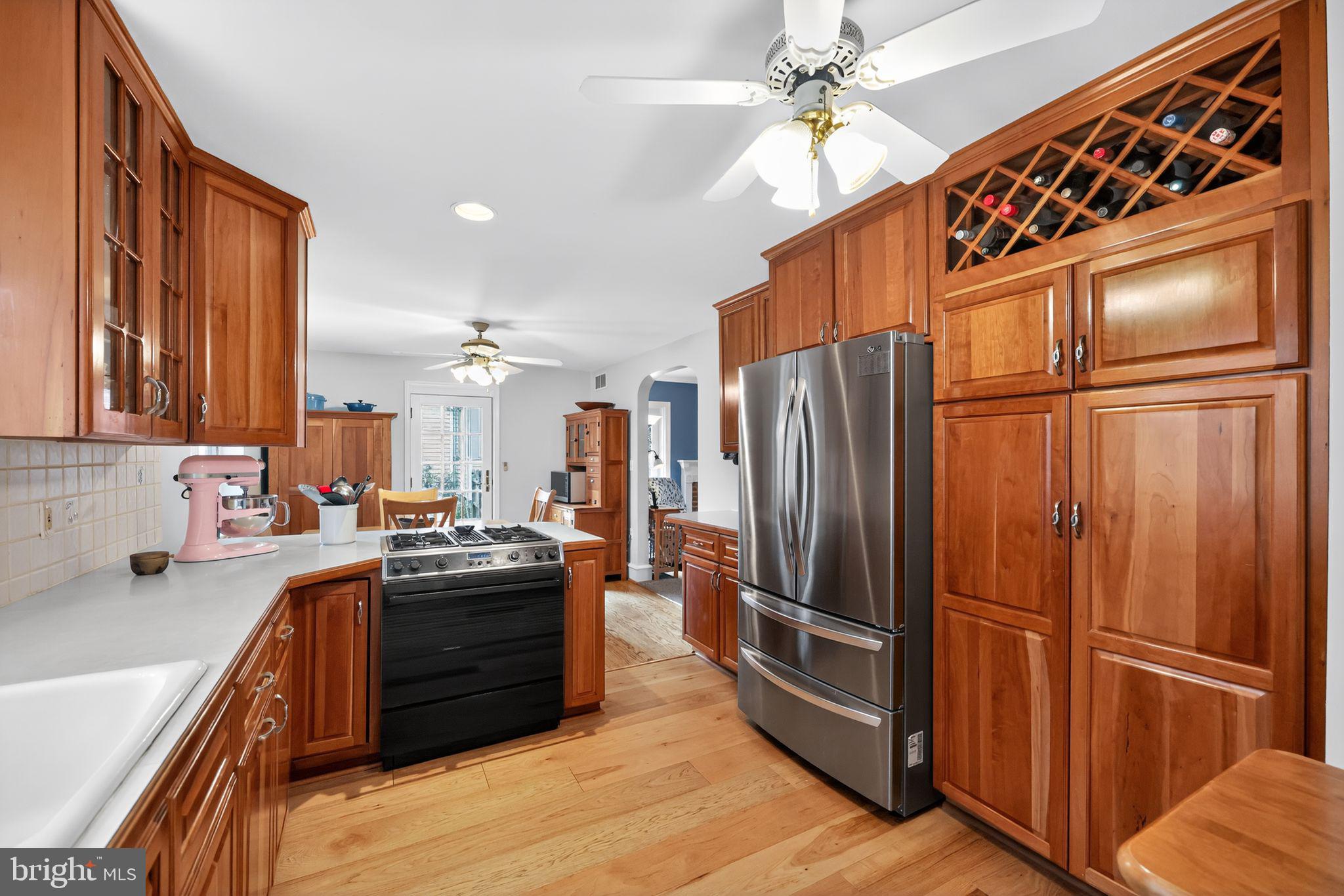 240 Hopkins Avenue Haddonfield, NJ 08033 - Photo 11 of 36 a kitchen with stainless steel appliances granite countertop a refrigerator and a sink