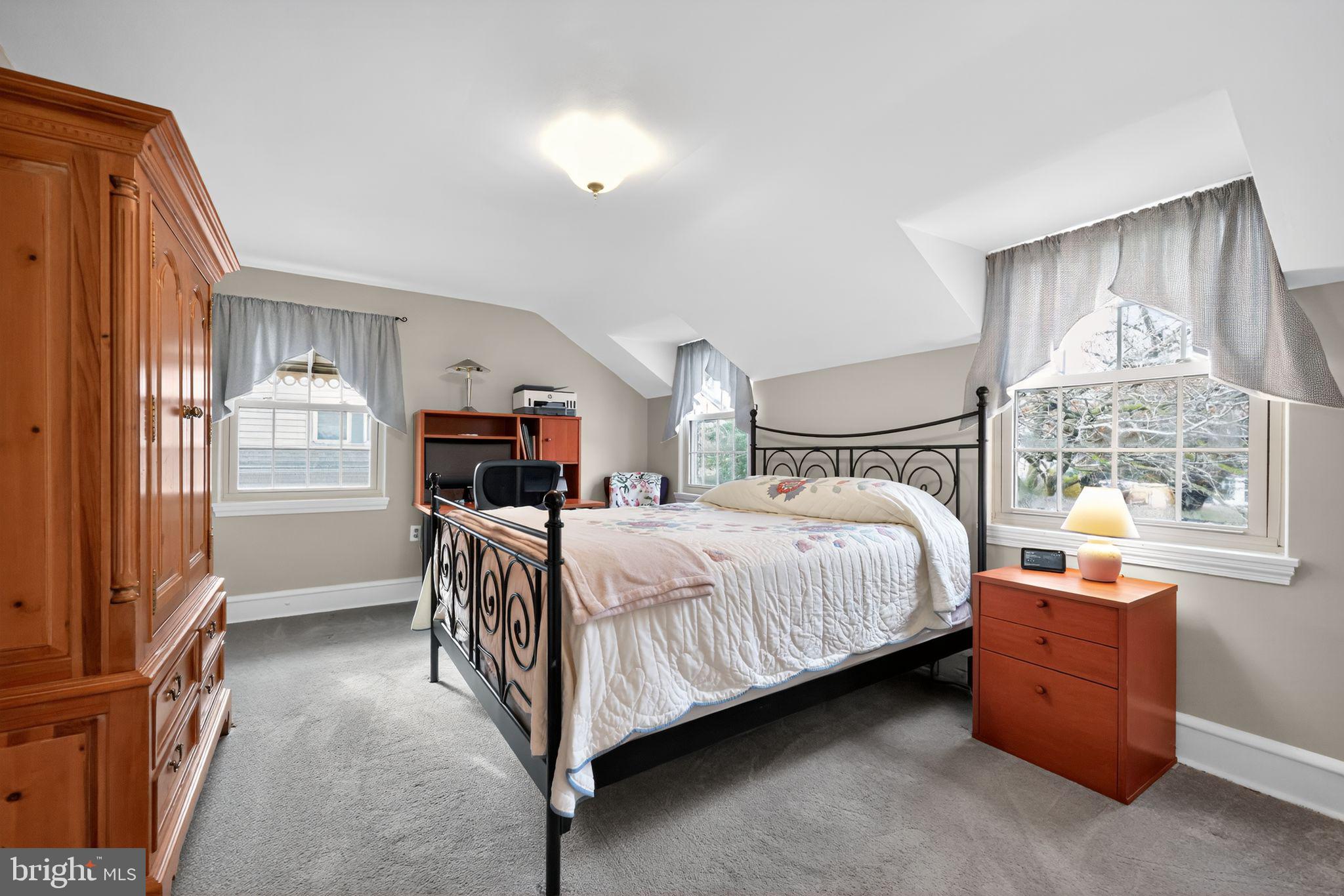 240 Hopkins Avenue Haddonfield, NJ 08033 - Photo 15 of 36 a bedroom with a bed and a flat tv screen on dresser