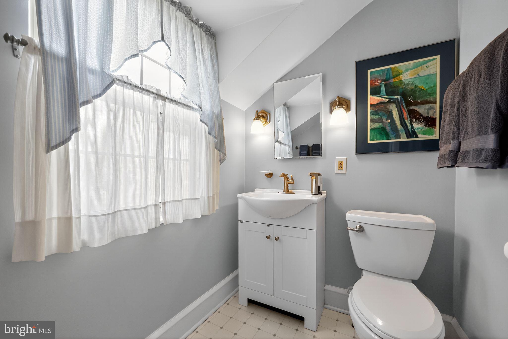 240 Hopkins Avenue Haddonfield, NJ 08033 - Photo 18 of 36 a bathroom with a toilet sink and mirror