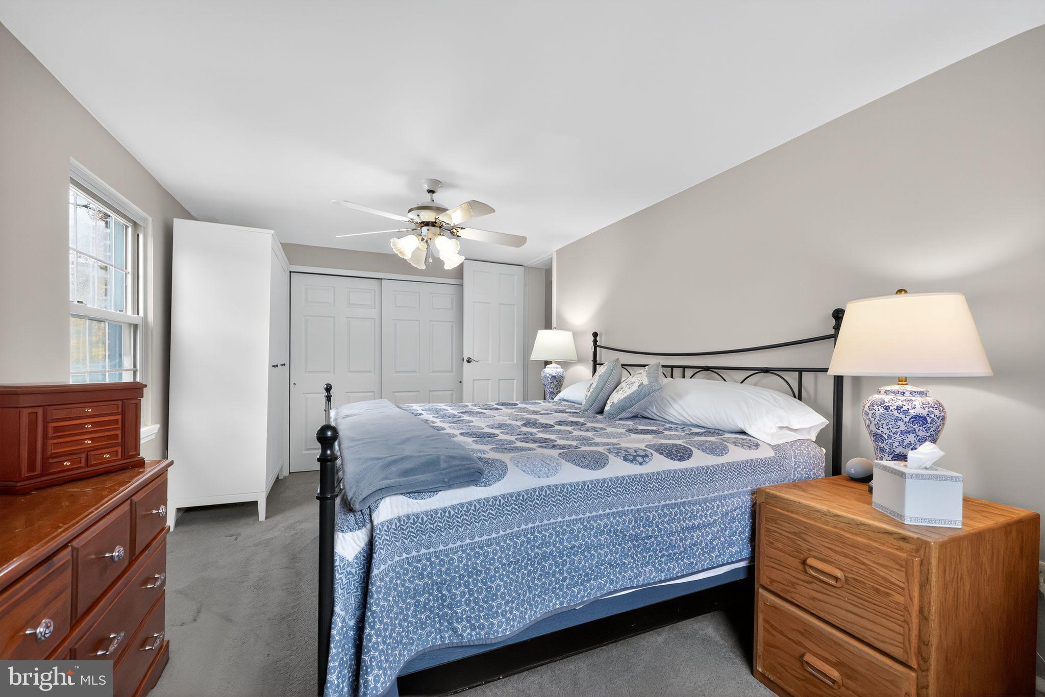 240 Hopkins Avenue Haddonfield, NJ 08033 - Photo 21 of 36 a bedroom with a bed and a chandelier