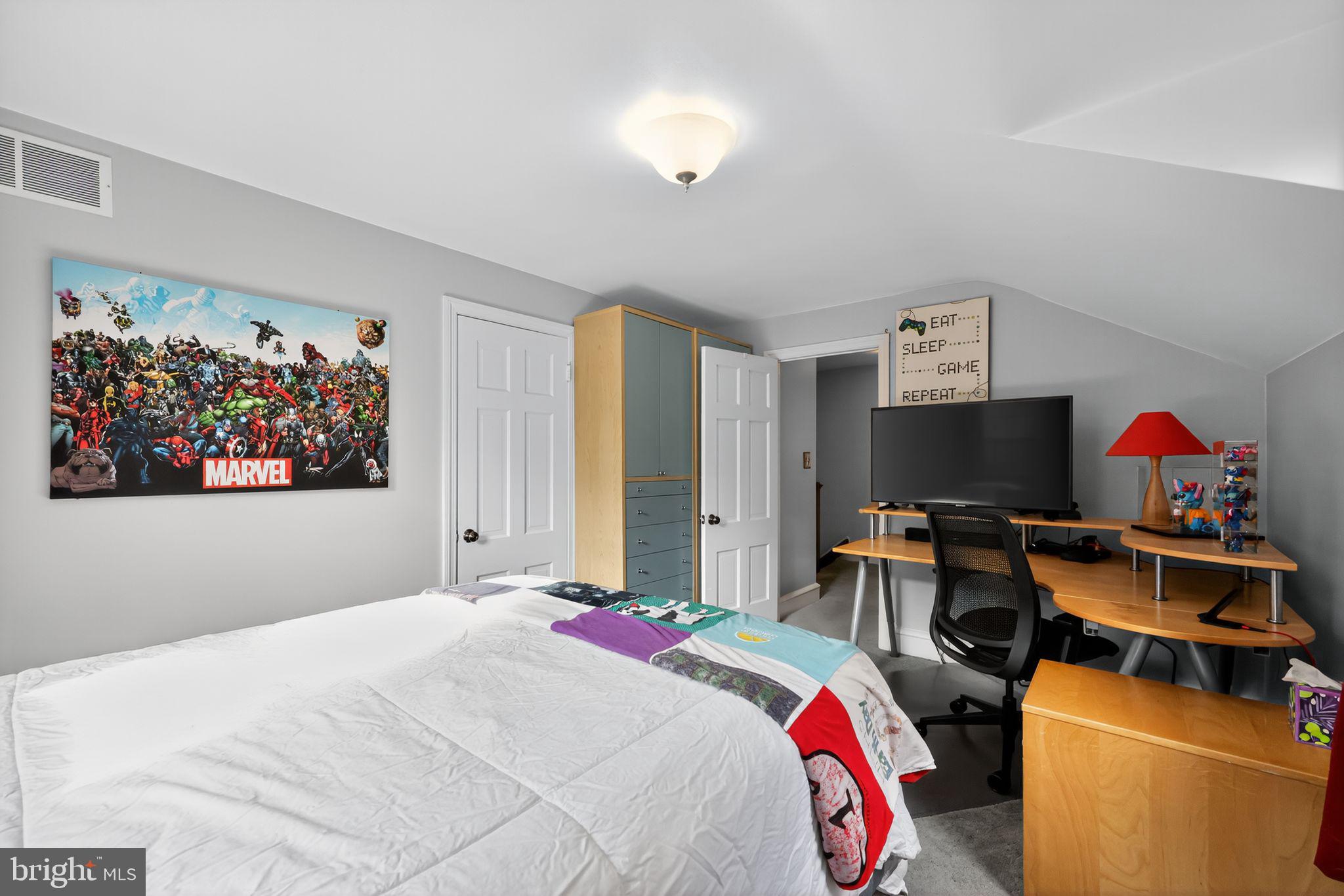 240 Hopkins Avenue Haddonfield, NJ 08033 - Photo 25 of 36 a bedroom with a bed and a flat screen tv