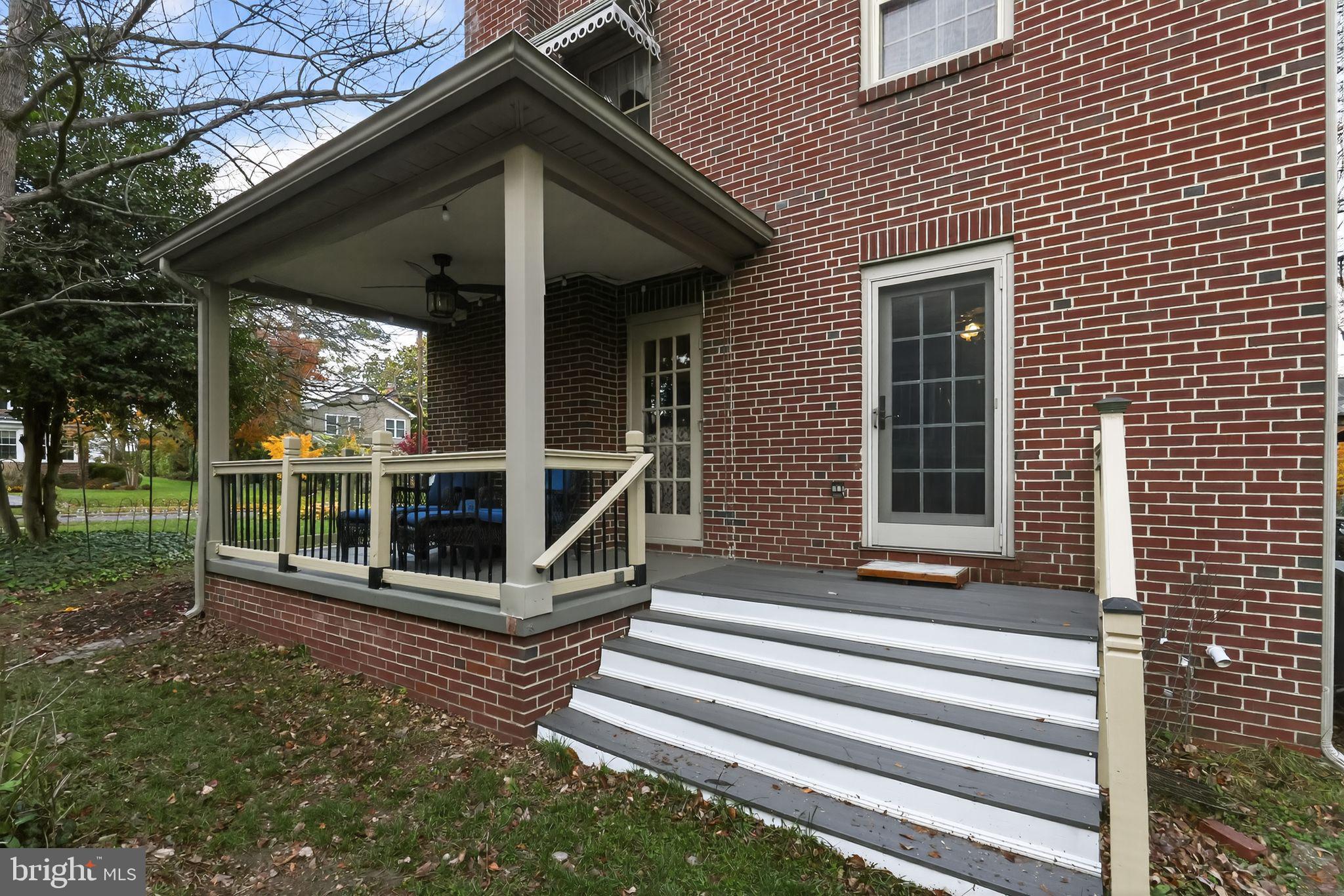 240 Hopkins Avenue Haddonfield, NJ 08033 - Photo 31 of 36 a view of a house with a large window and wooden fence