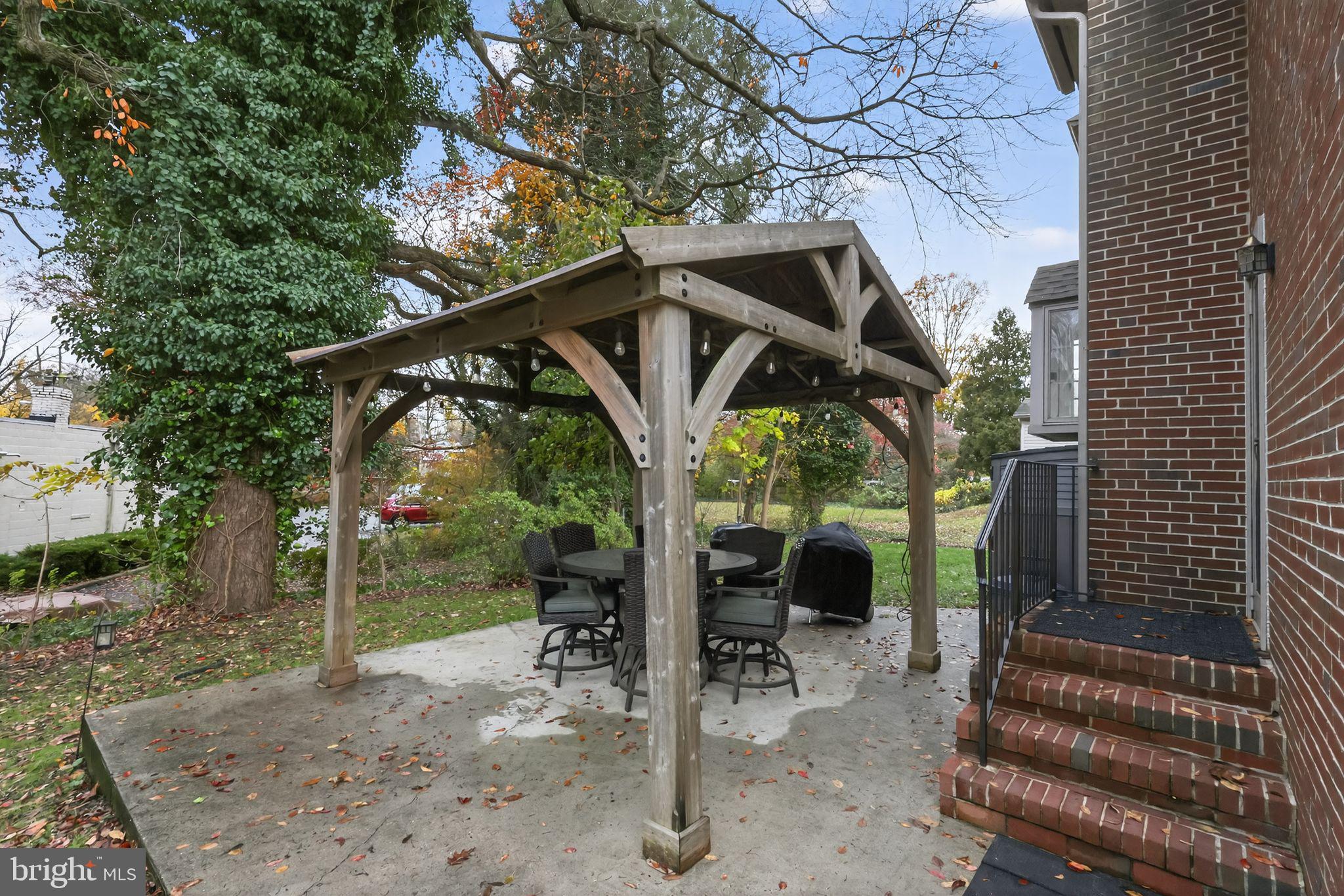 240 Hopkins Avenue Haddonfield, NJ 08033 - Photo 34 of 36 a view of a chair and table in backyard