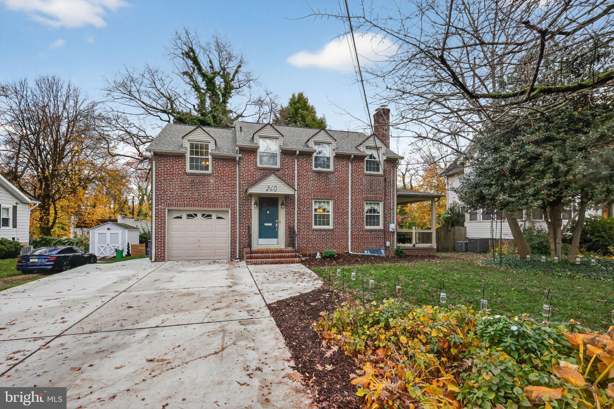 240 Hopkins Avenue Haddonfield, NJ 08033 - Photo 36 of 36 a front view of a house with a yard and garage