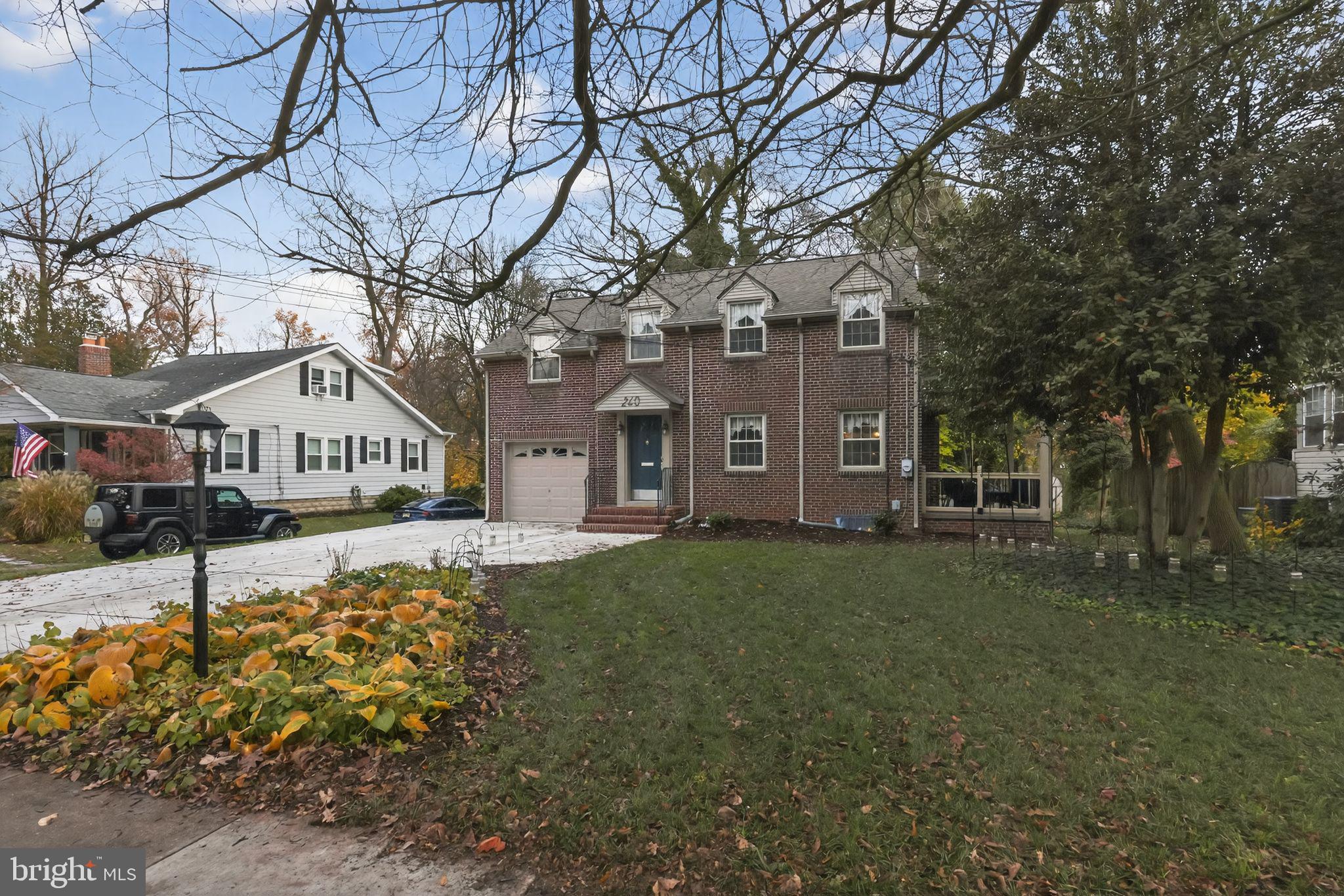 240 Hopkins Avenue Haddonfield, NJ 08033 - Photo 6 of 36 a view of a house with a yard