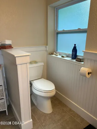 a bathroom with a toilet and a sink