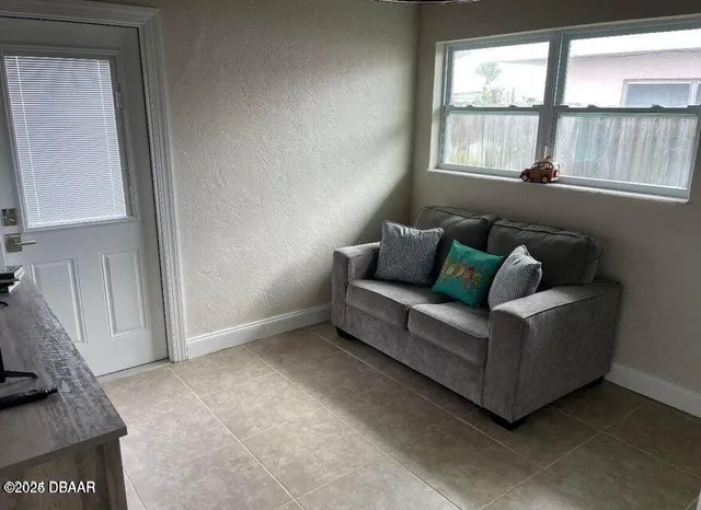 a living room with furniture and a window