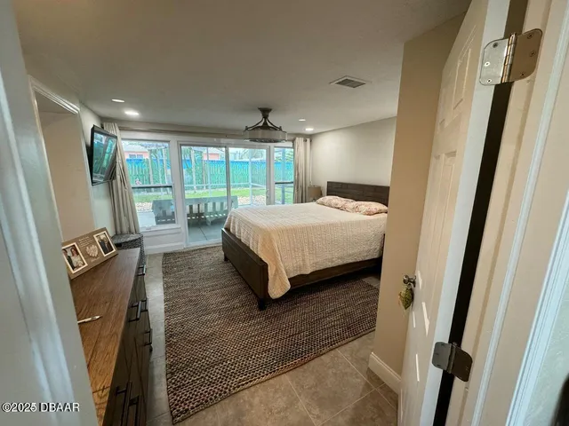 a bedroom with a bed window and a bed