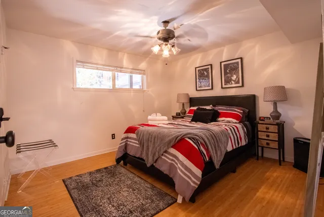 a hallway with cabinets and wooden floor