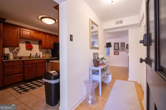 a kitchen with stainless steel appliances granite countertop a stove and a microwave