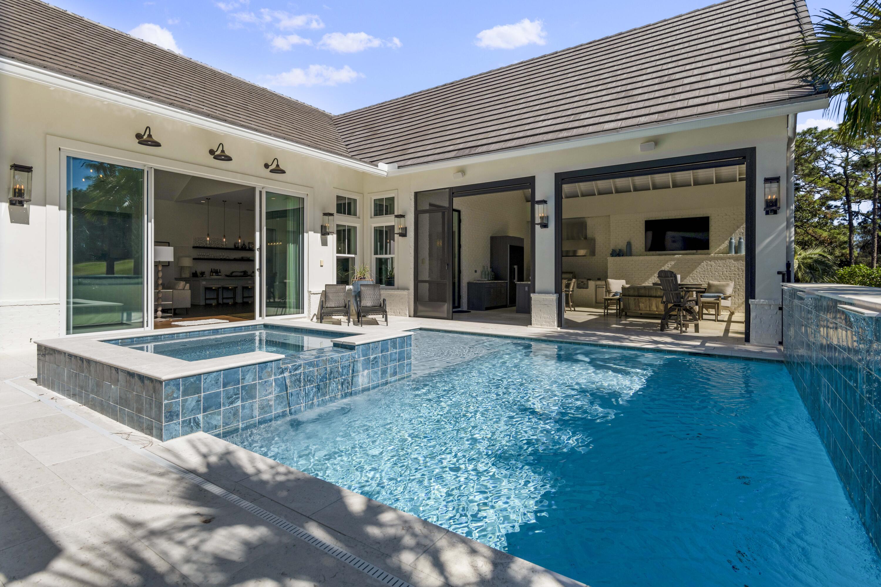 2924 Sand Pine Road Miramar Beach, FL 32550 - Photo 11 of 98 a view of a patio with table and chairs and potted plants