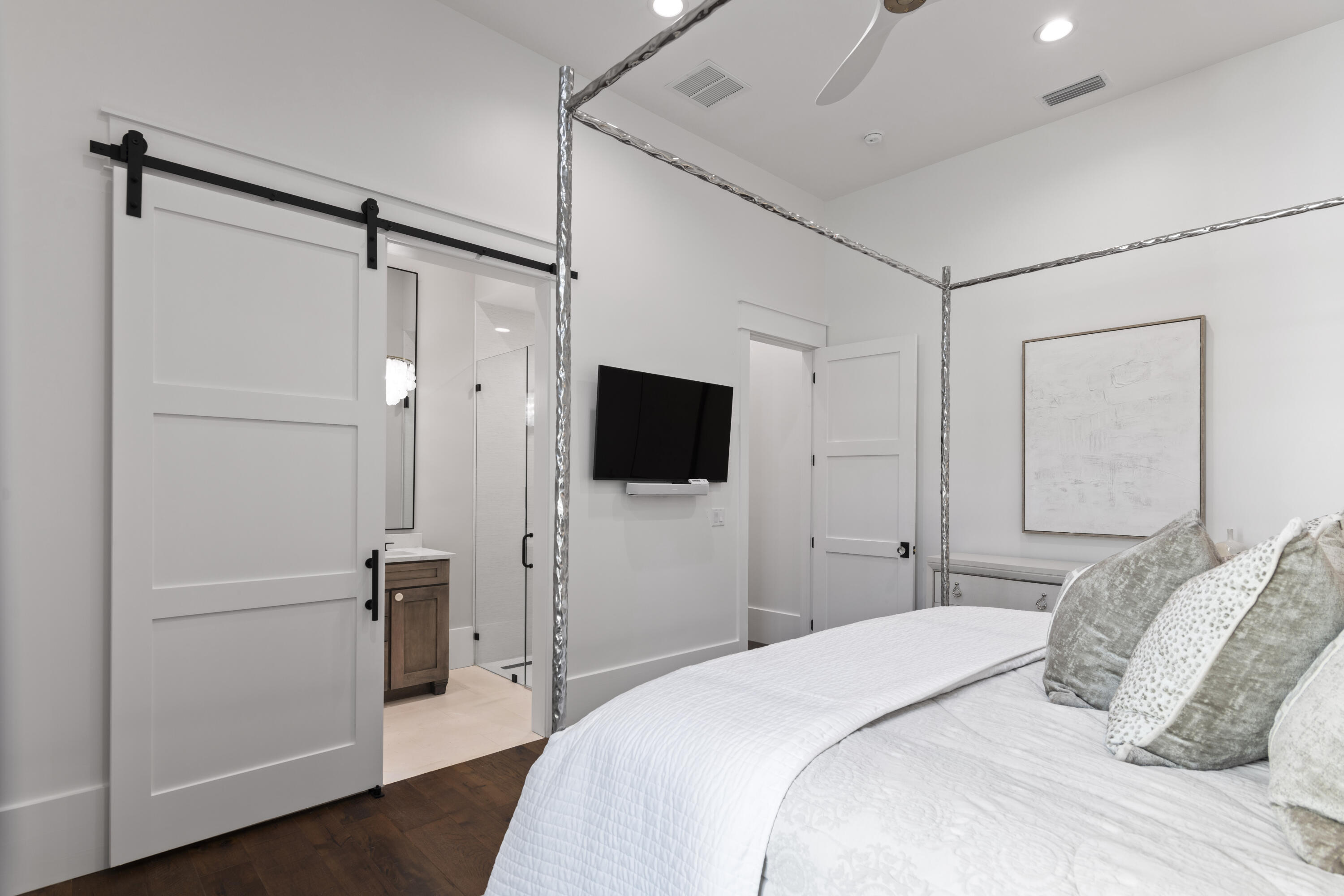 2924 Sand Pine Road Miramar Beach, FL 32550 - Photo 50 of 98 a bedroom with a bed and a flat screen tv