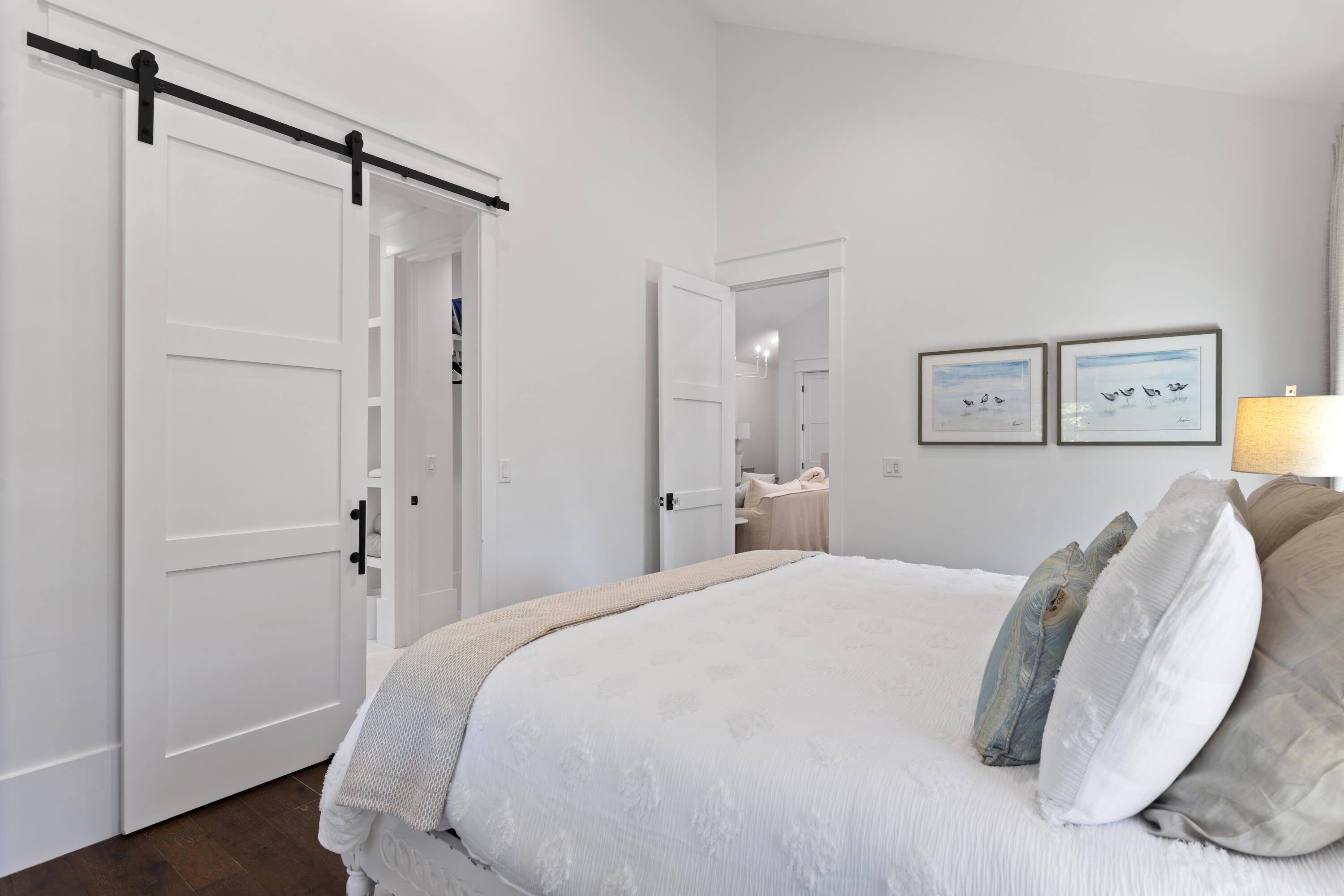 2924 Sand Pine Road Miramar Beach, FL 32550 - Photo 60 of 98 a bedroom with a bed and a wooden floor