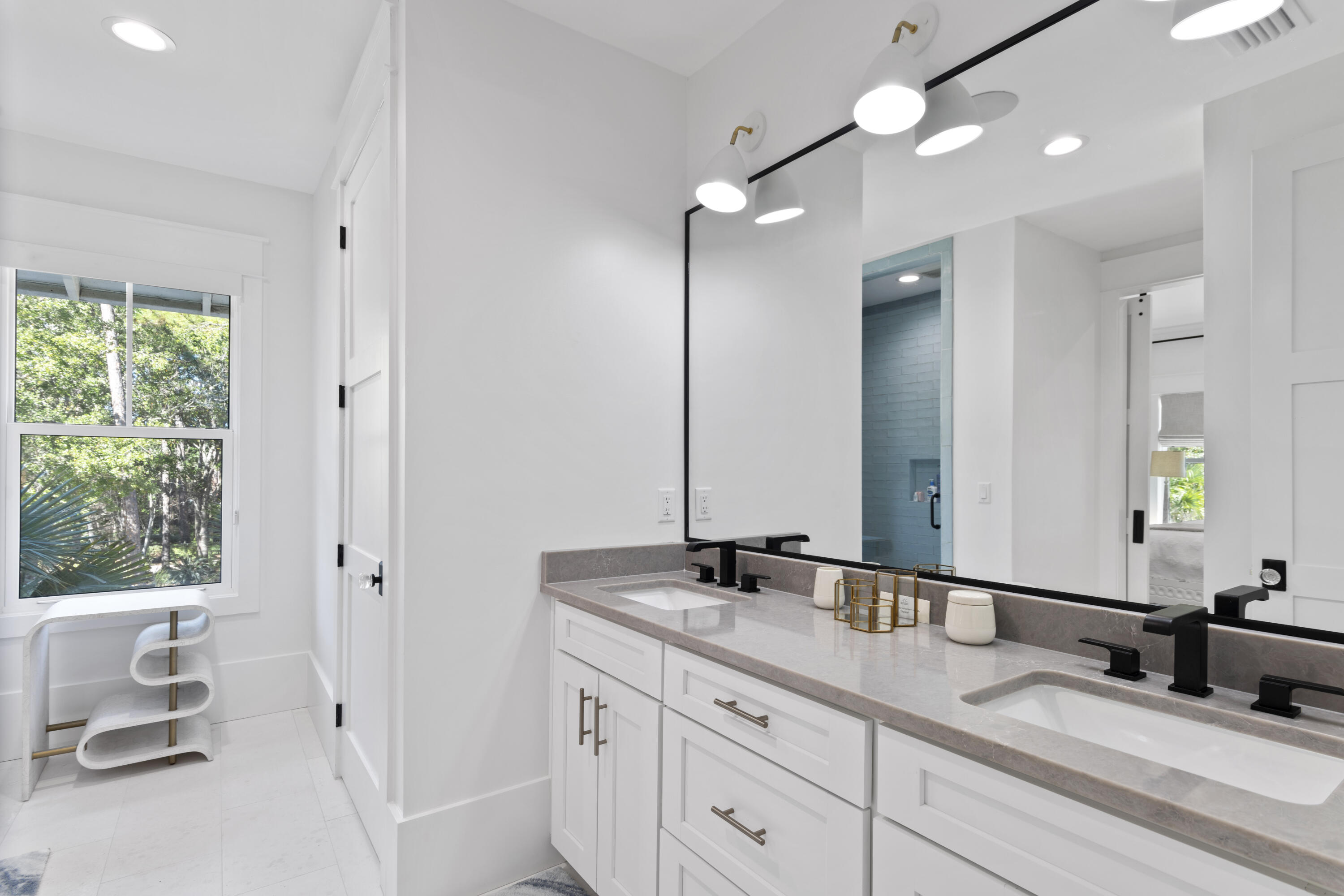 2924 Sand Pine Road Miramar Beach, FL 32550 - Photo 61 of 98 a bathroom with a double vanity sink and a mirror