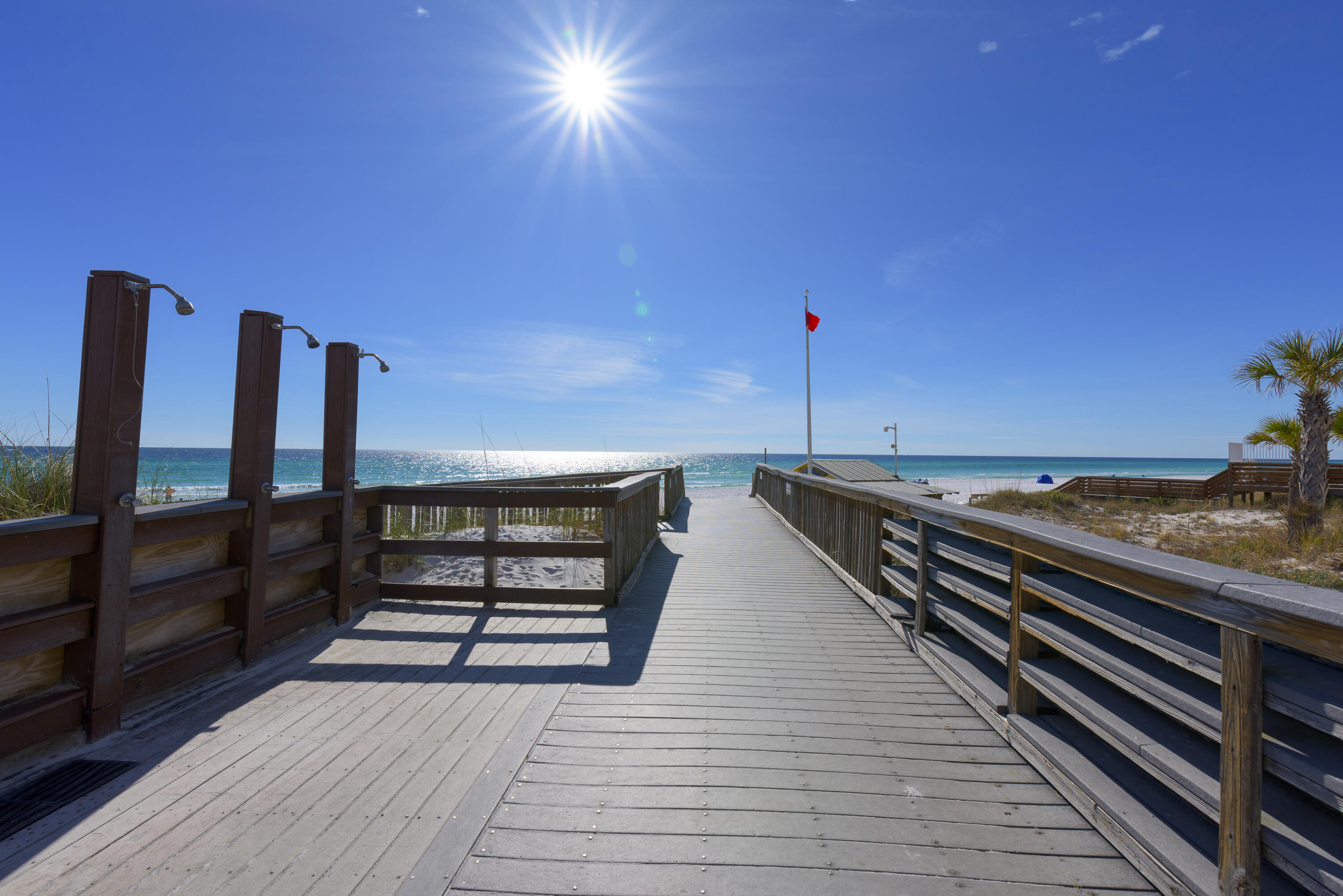 2924 Sand Pine Road Miramar Beach, FL 32550 - Photo 79 of 98 a view of a balcony with wooden floor and iron fence