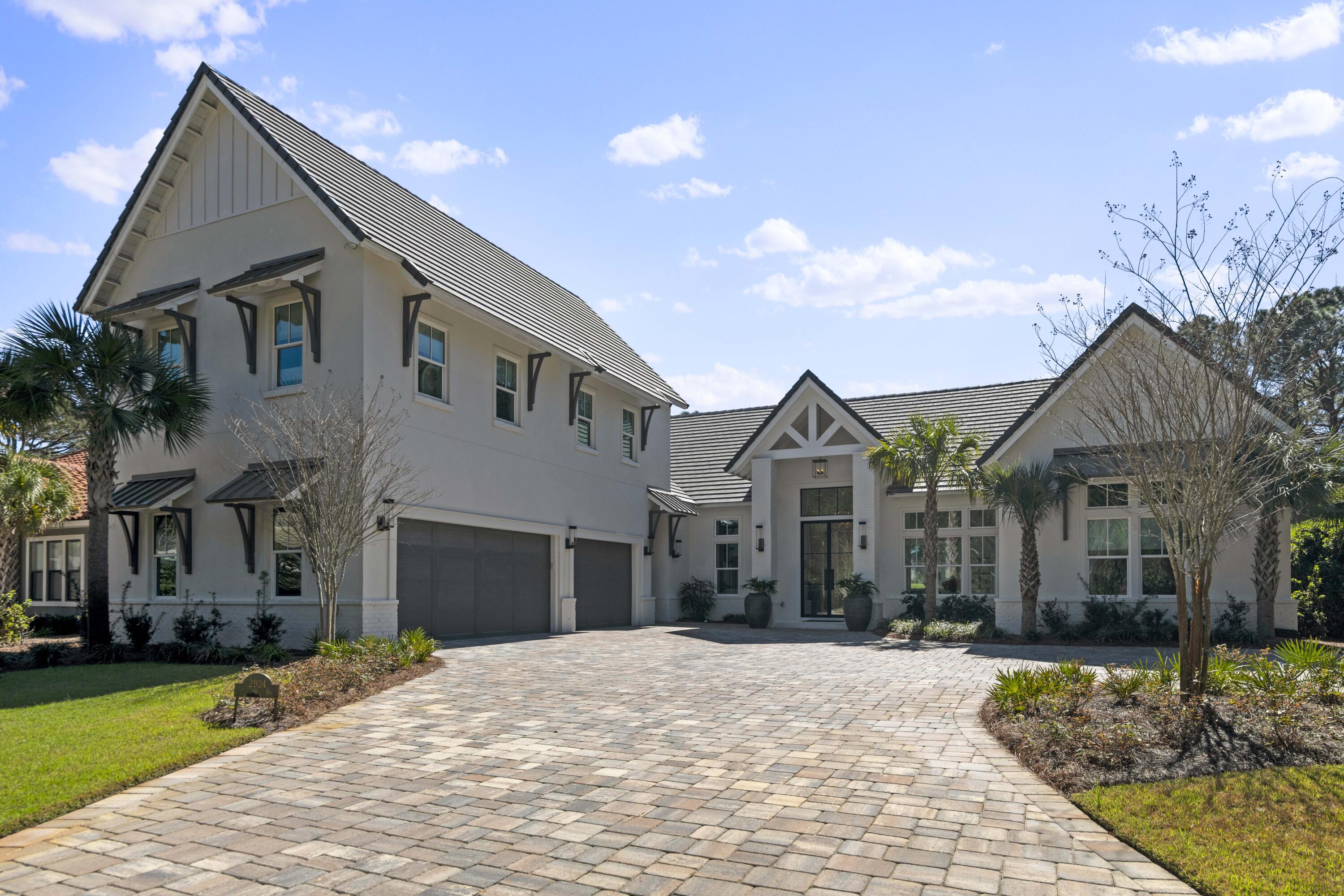 2924 Sand Pine Road Miramar Beach, FL 32550 - Photo 10 of 98 a front view of a house with a yard