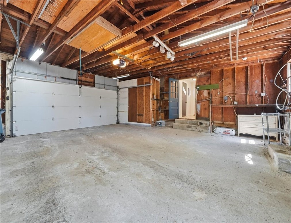 322 Rocky Hill Road Scituate, RI 02857 - Photo 39 of 50 Complete with garage door opener, direct interior access, and a rare cedar closet for protected storage, this space adds both function and flexibility buyers will appreciate.