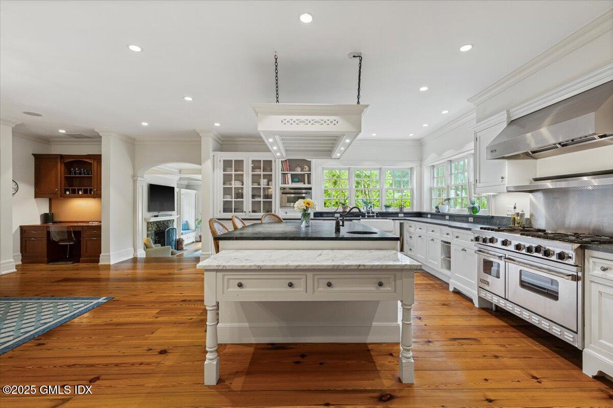 203 Riverside Avenue Riverside, CT 06878 - Photo 11 of 40 a large kitchen with stainless steel appliances granite countertop a stove and a wooden floors