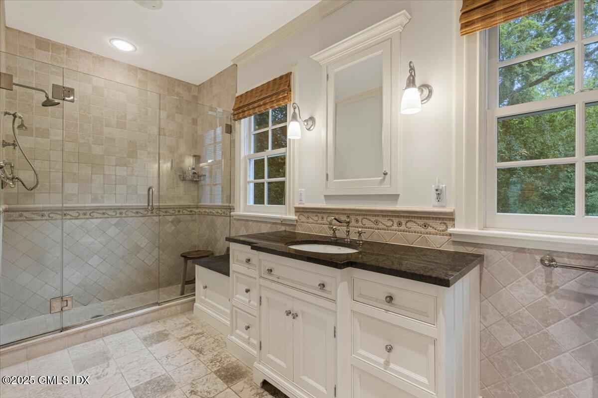 203 Riverside Avenue Riverside, CT 06878 - Photo 23 of 40 a bathroom with a sink and a mirror