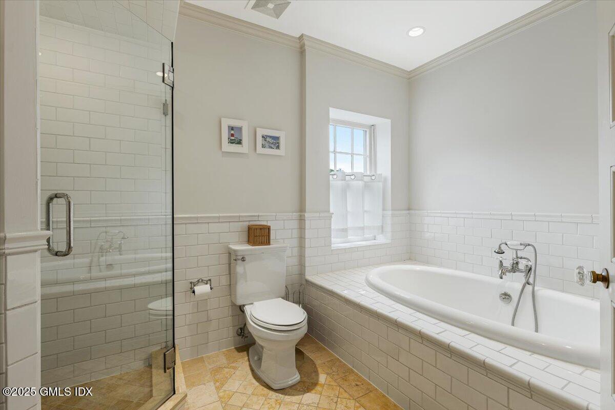 203 Riverside Avenue Riverside, CT 06878 - Photo 28 of 40 a bathroom with a sink a toilet and shower