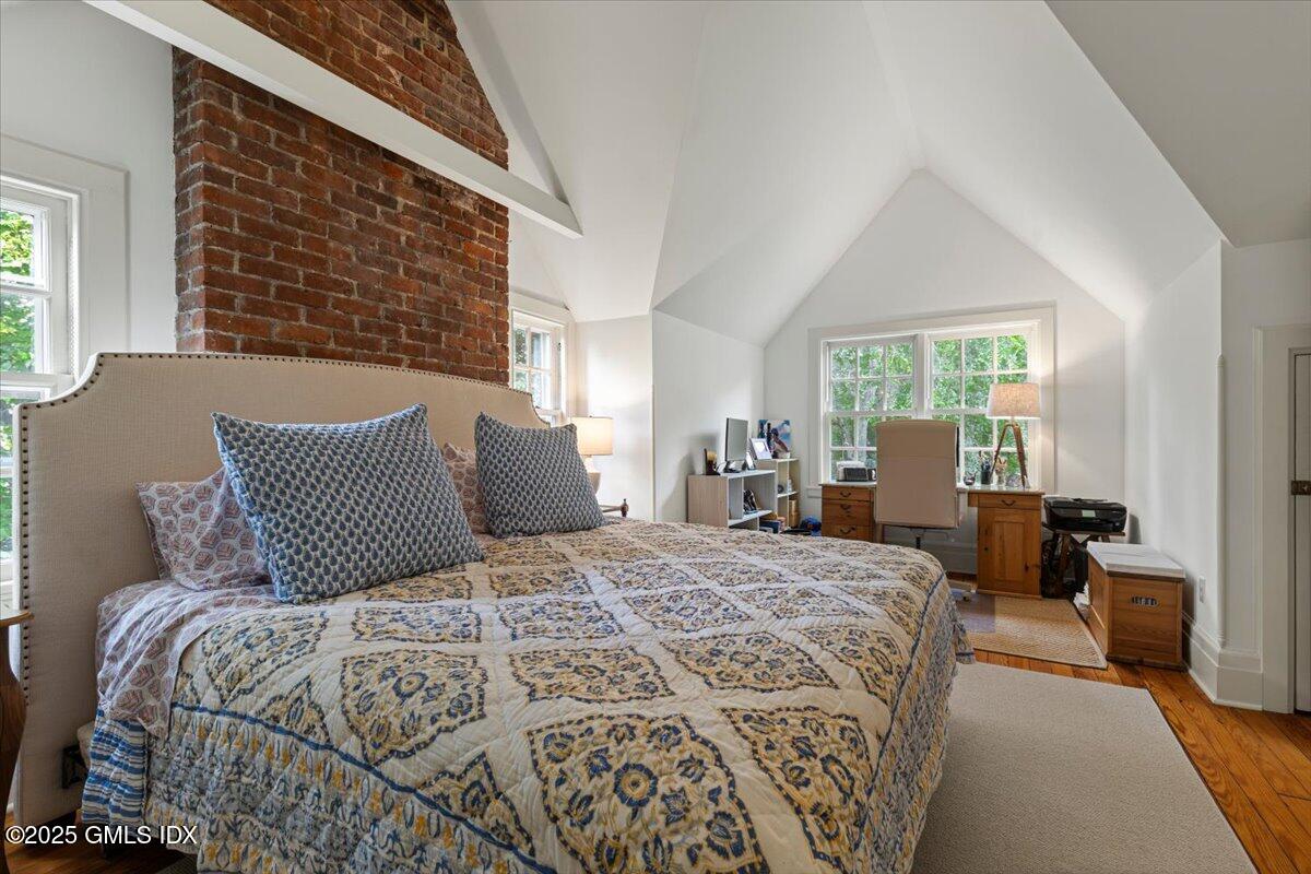 203 Riverside Avenue Riverside, CT 06878 - Photo 29 of 40 a bedroom with a large bed and a window