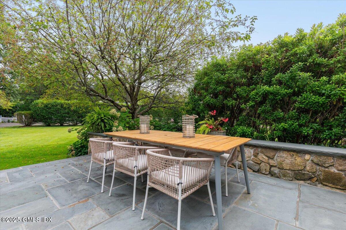 203 Riverside Avenue Riverside, CT 06878 - Photo 36 of 40 a patio with table and chairs