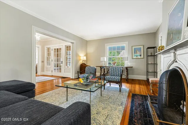 a living room with furniture fireplace and rug