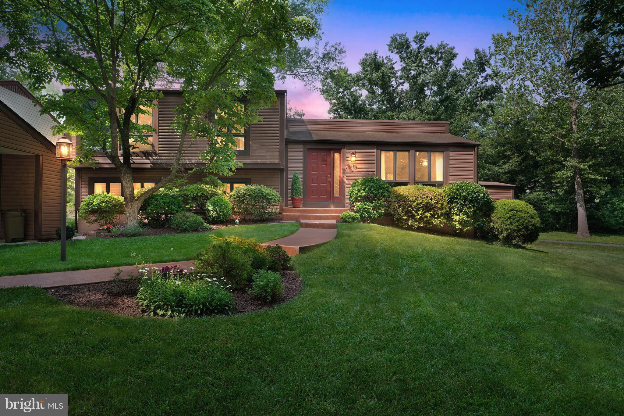 6411 Sunset Light Columbia, MD 21045 - Photo 1 of 37 a front view of a house with a yard