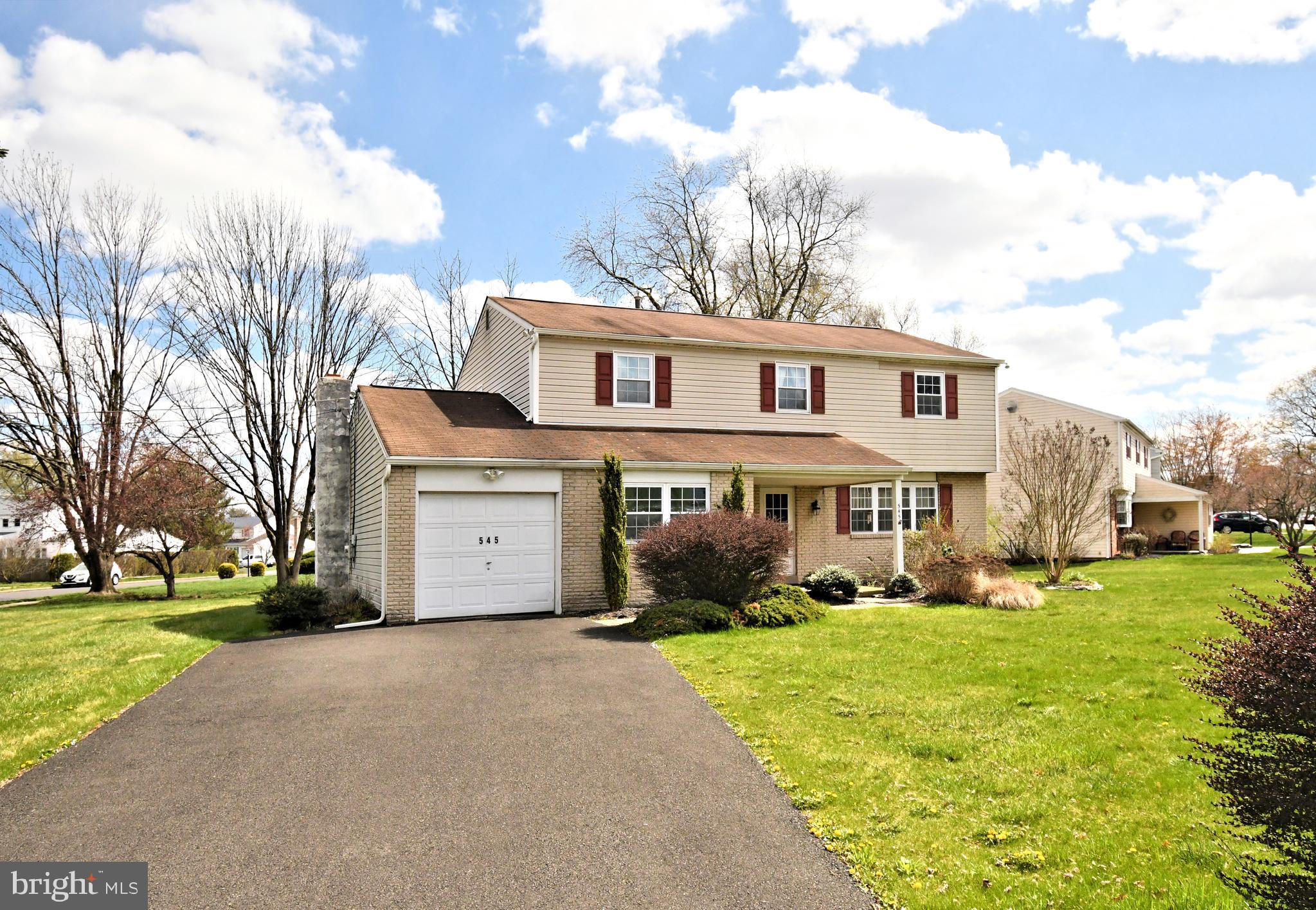545 Brook Lane Warminster, PA 18974 - Photo 1 of 25 a front view of a house with a yard and trees