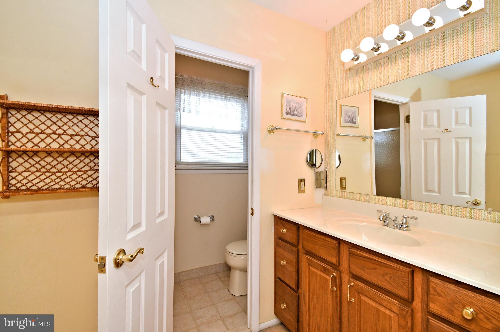 545 Brook Lane Warminster, PA 18974 - Photo 16 of 25 a bathroom with a double vanity sink mirror and toilet