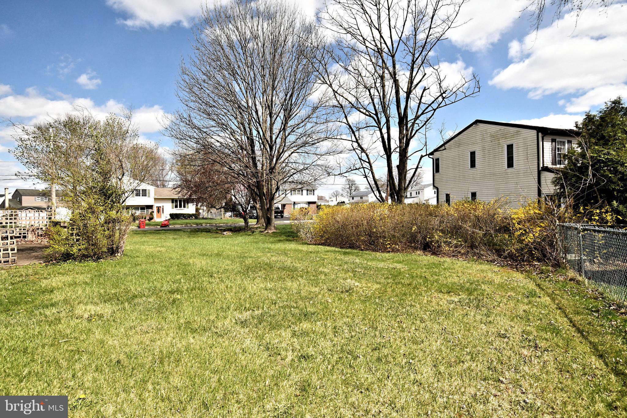 545 Brook Lane Warminster, PA 18974 - Photo 23 of 25 a front view of a house with a yard and garage