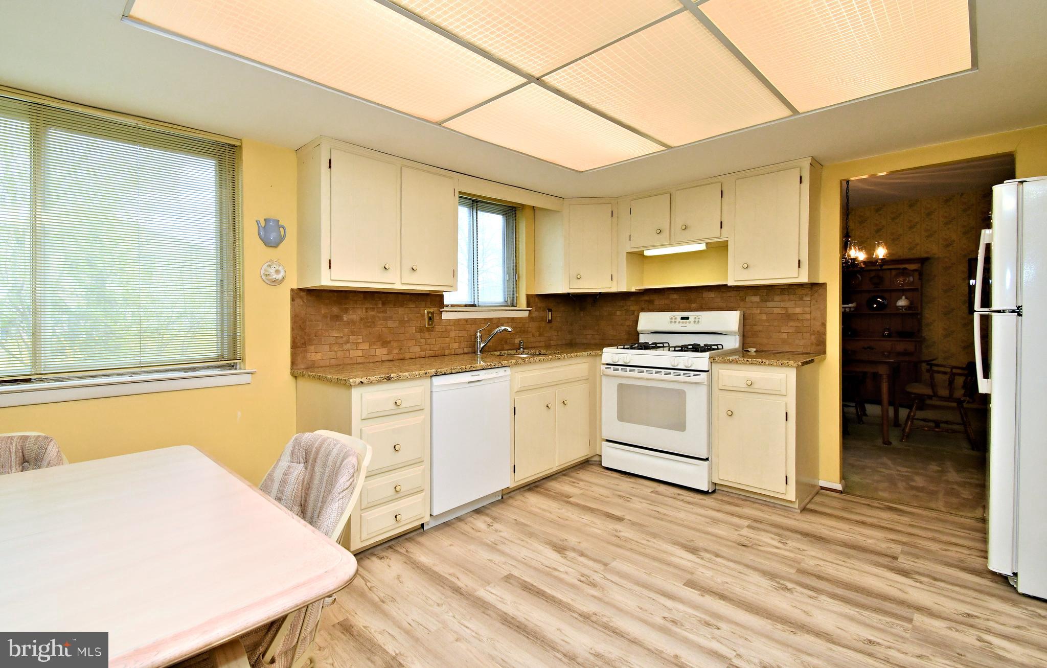 545 Brook Lane Warminster, PA 18974 - Photo 8 of 25 a kitchen with stainless steel appliances white cabinets a sink a stove a refrigerator and a microwave