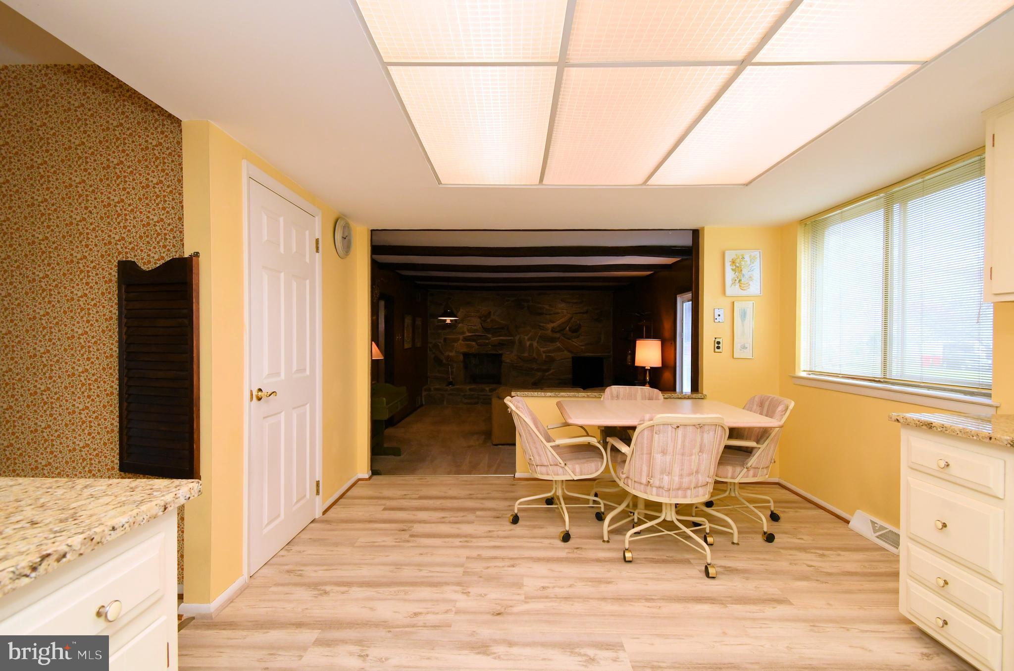 545 Brook Lane Warminster, PA 18974 - Photo 9 of 25 a dining room with a wooden table and chairs