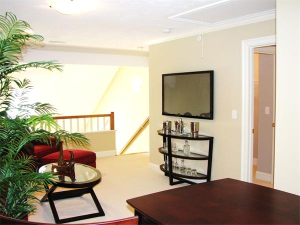 11 C Trail Ridge Way, Unit 35 Harvard, MA 01451 - Photo 21 of 30 a living room with furniture and a flat screen tv