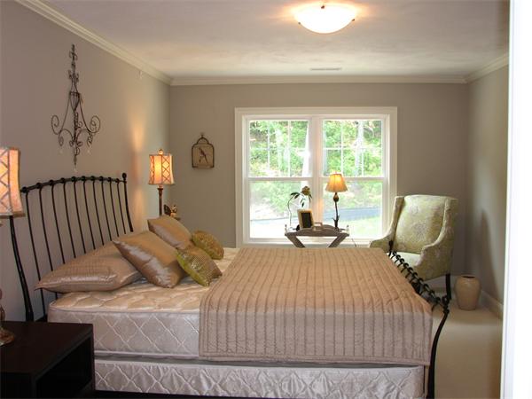 11 C Trail Ridge Way, Unit 35 Harvard, MA 01451 - Photo 23 of 30 a bedroom with a bed and chair