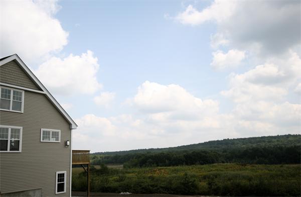 11 C Trail Ridge Way, Unit 35 Harvard, MA 01451 - Photo 30 of 30 a view of a house with a yard