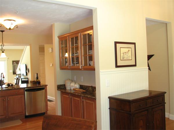 11 C Trail Ridge Way, Unit 35 Harvard, MA 01451 - Photo 4 of 30 a kitchen with stainless steel appliances granite countertop a stove a sink and a refrigerator