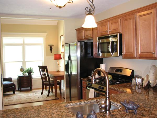 11 C Trail Ridge Way, Unit 35 Harvard, MA 01451 - Photo 6 of 30 a view of a dining room with furniture window and outside view