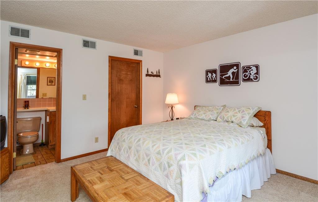 500 Bills Ranch Road, Unit 271 Frisco, CO 80443 - Photo 14 of 22 a bedroom with a bed and a table