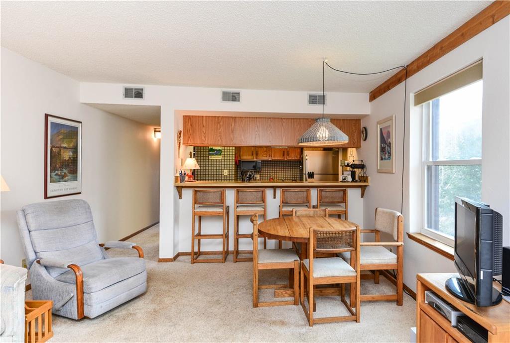 500 Bills Ranch Road, Unit 271 Frisco, CO 80443 - Photo 6 of 22 a dining room with furniture and a flat screen tv