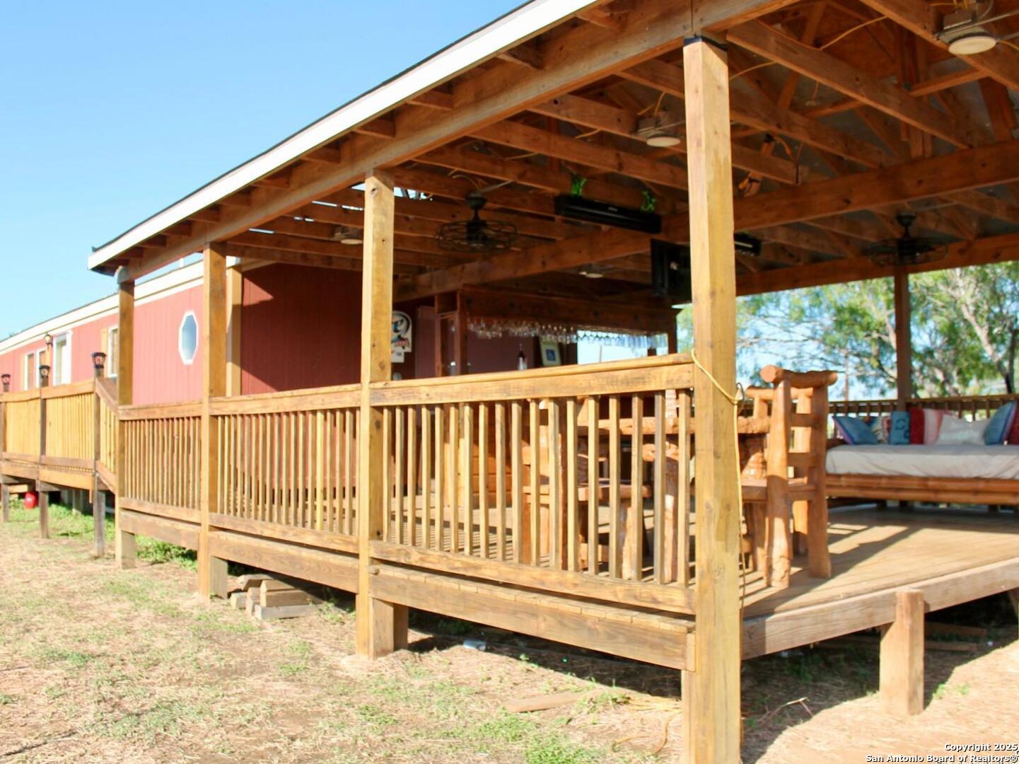 13014 Bernhardt Road San Antonio, TX 78263 - Photo 23 of 29 a view of a balcony with chairs