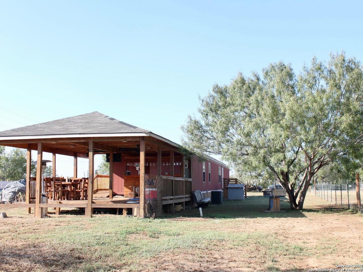 13014 Bernhardt Road San Antonio, TX 78263 - Photo 24 of 29 a view of a house with a yard