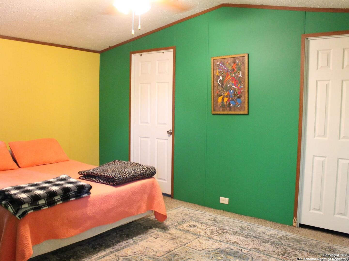 13014 Bernhardt Road San Antonio, TX 78263 - Photo 9 of 29 a bedroom with a bed and a window