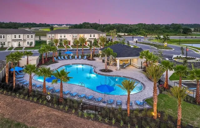 an outdoor space with seating area and city view