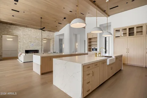 a kitchen with sink a stove and a refrigerator