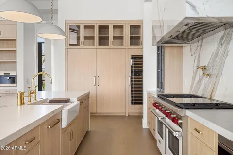 a kitchen with a sink and an oven